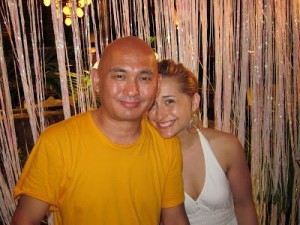 Unmonk-like behavior. Drinking, carousing and having a ball at Necker Island, Lama Tenzin is pictured with Allison Mack
